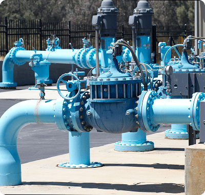 Blue industrial water pipes outdoors